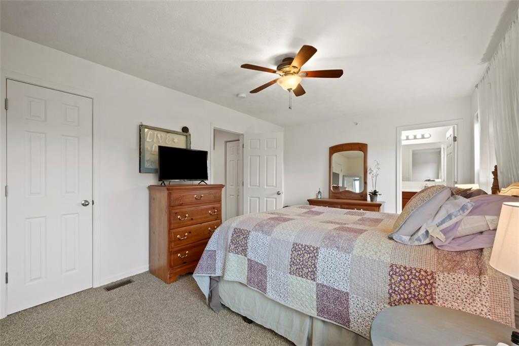 141 Rylie Drive Harmony, PA 16037 - Photo 17 of 31 The bedrooms suite includes a walk in closet and it's own full bathroom ensuite. Notice the overhead light fixture/fan combo which brightens the room even on those cloudy days.
