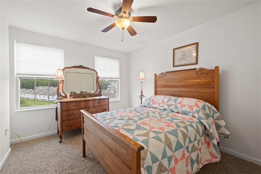 141 Rylie Drive Harmony, PA 16037 - Photo 20 of 31 The second bedroom as well as the rest of the home is done in neutral tones.