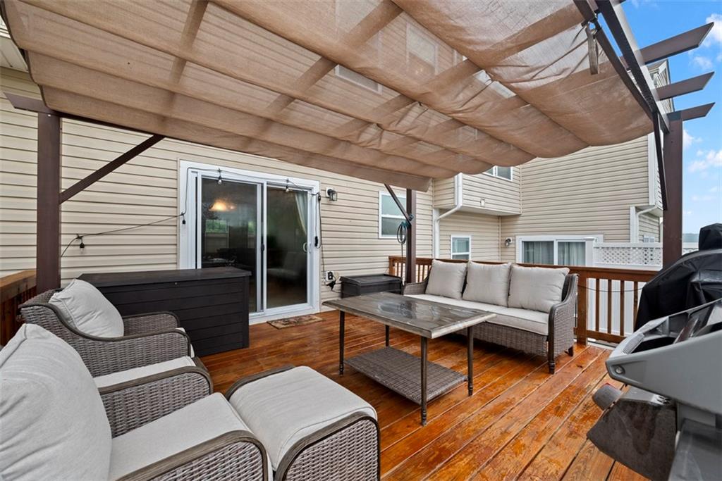 141 Rylie Drive Harmony, PA 16037 - Photo 2 of 31 The amazing 16x16 deck with covered pergola is an extension of the townhouse.