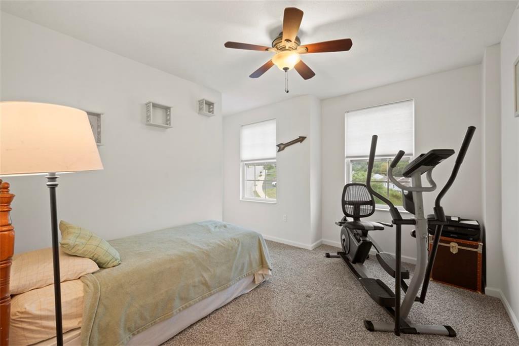 141 Rylie Drive Harmony, PA 16037 - Photo 22 of 31 A third bedroom has a closet around the corner. Notice that all of the bedrooms have a ceiling fan/light combo which isn't always found in all townhouses.