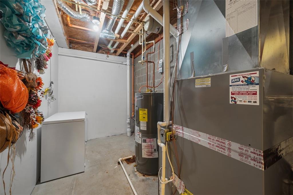 141 Rylie Drive Harmony, PA 16037 - Photo 28 of 31 The lower level has some storage in the utility room. The 2 car garage is oversize spanning the depth of the unit and has space for your cars and lots of storage space as well or even space for a workout area.