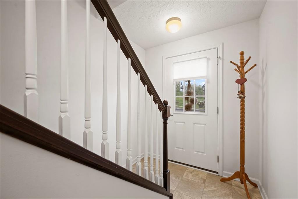 141 Rylie Drive Harmony, PA 16037 - Photo 29 of 31 The entry leads to the garage or the front door.