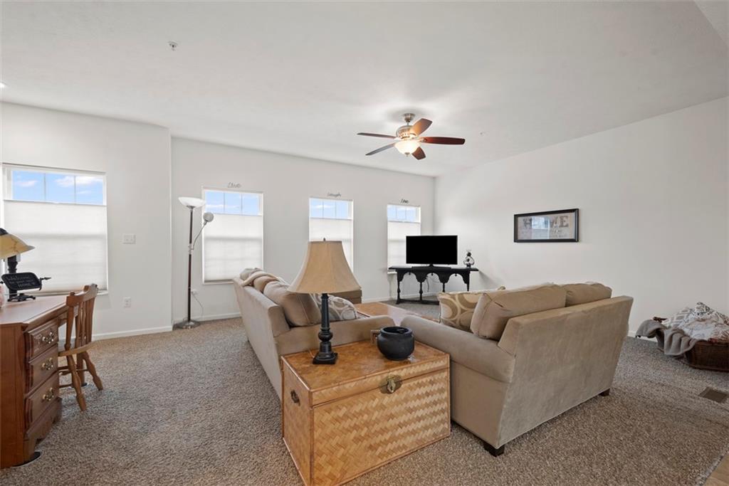 141 Rylie Drive Harmony, PA 16037 - Photo 7 of 31 The wall of windows filters in ample daylight keeping this unit light and bright all day long.