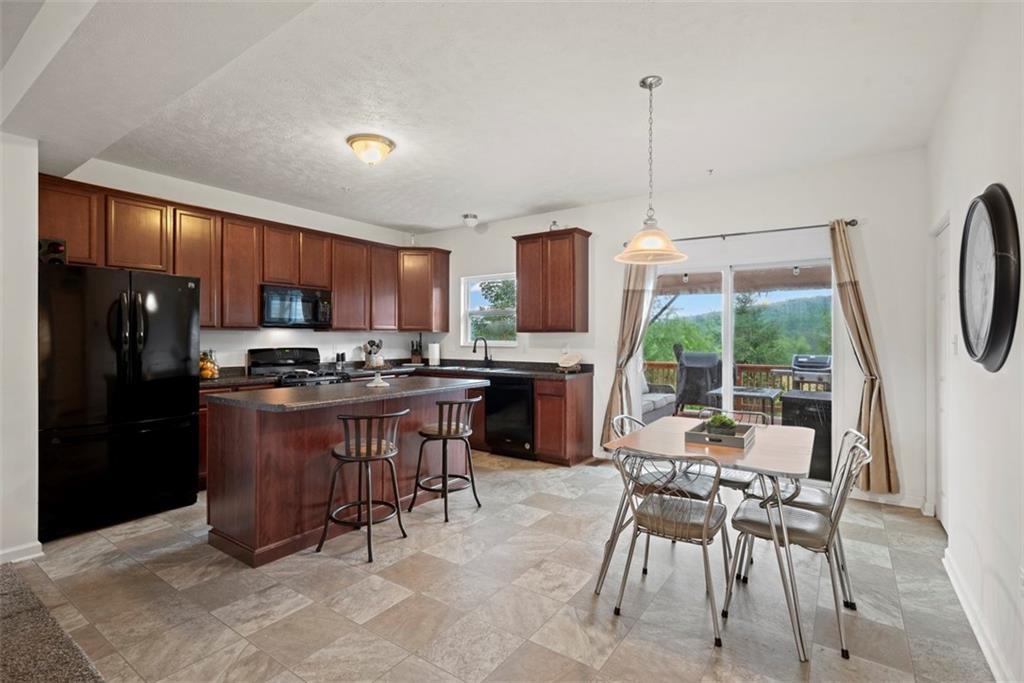 141 Rylie Drive Harmony, PA 16037 - Photo 9 of 31 The open kitchen allows space to gather with family and friends.