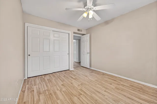 a view of a patio with a table chairs and a backyard