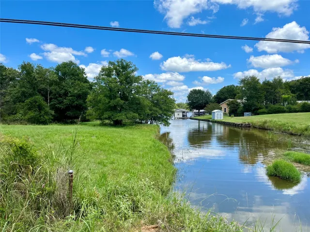 a view of a lake with a big yard