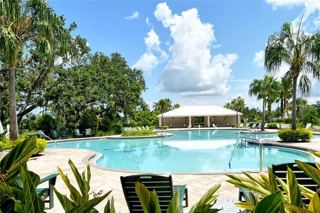 a view of balcony with outdoor seating and green space