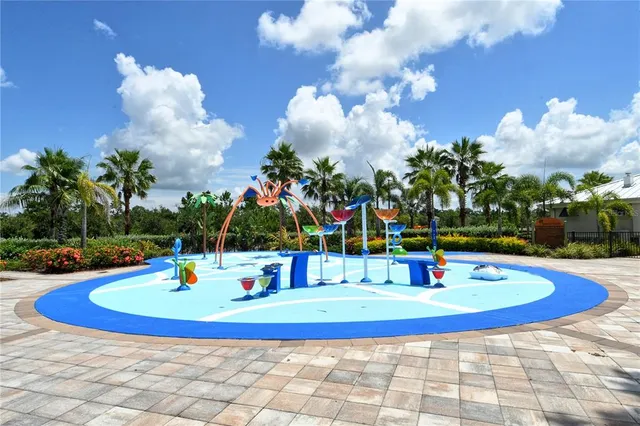 a view of a house with swimming pool and dining table