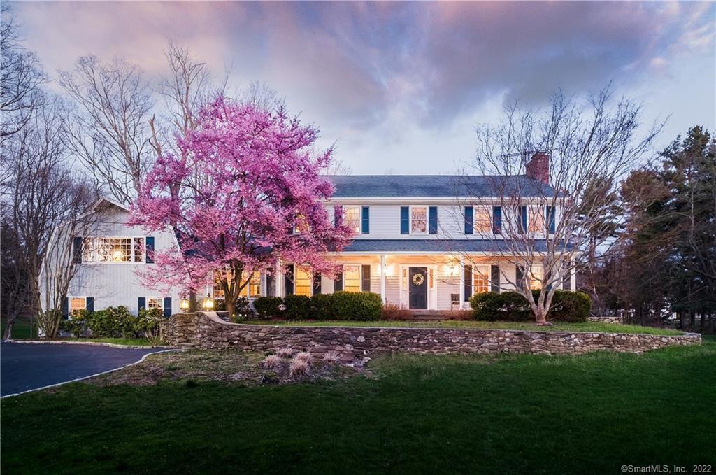 888 Banks North Road Fairfield, CT 06824 - Photo 1 of 1 a front view of a house with a garden