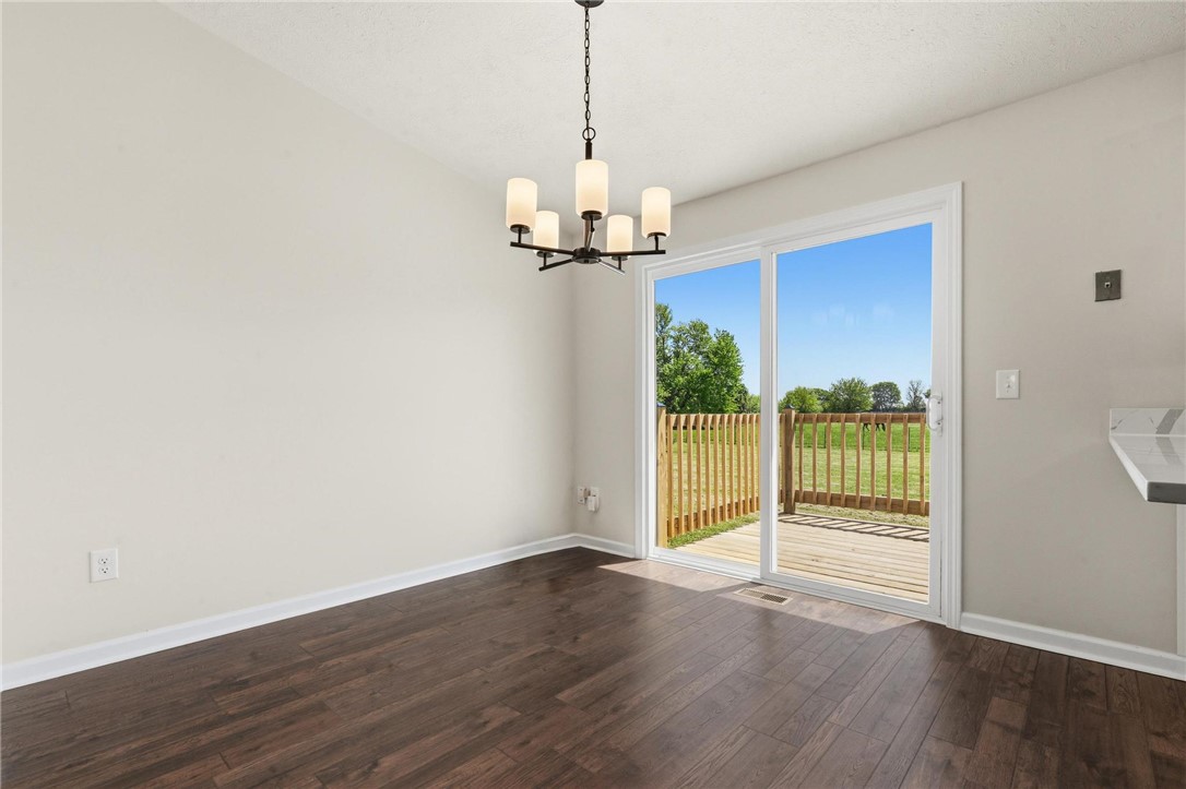 1353 Foust Road Xenia, OH 45385 - Photo 32 of 50 This bright space features a chandelier and direct access to an outdoor deck.