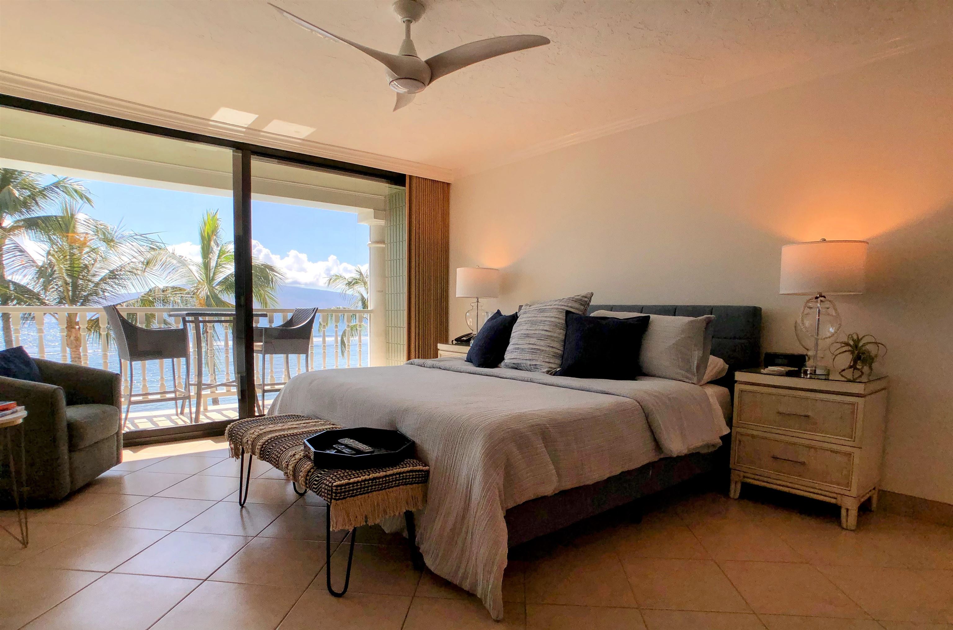 475 Front Street, Unit 419 Lahaina, HI 96761 - Photo 11 of 27 a bedroom with a bed and large window