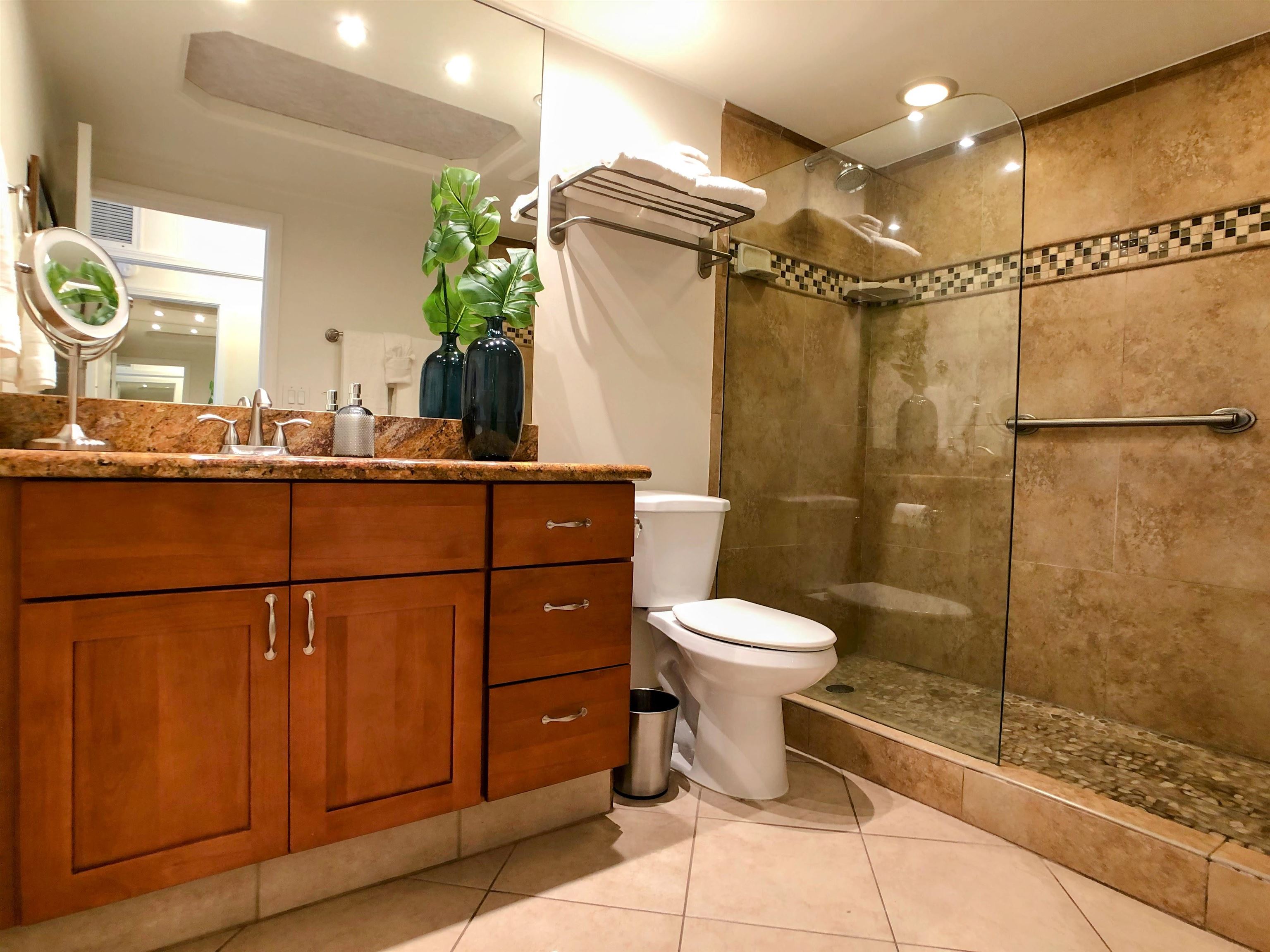 475 Front Street, Unit 419 Lahaina, HI 96761 - Photo 12 of 27 a bathroom with a toilet sink and shower