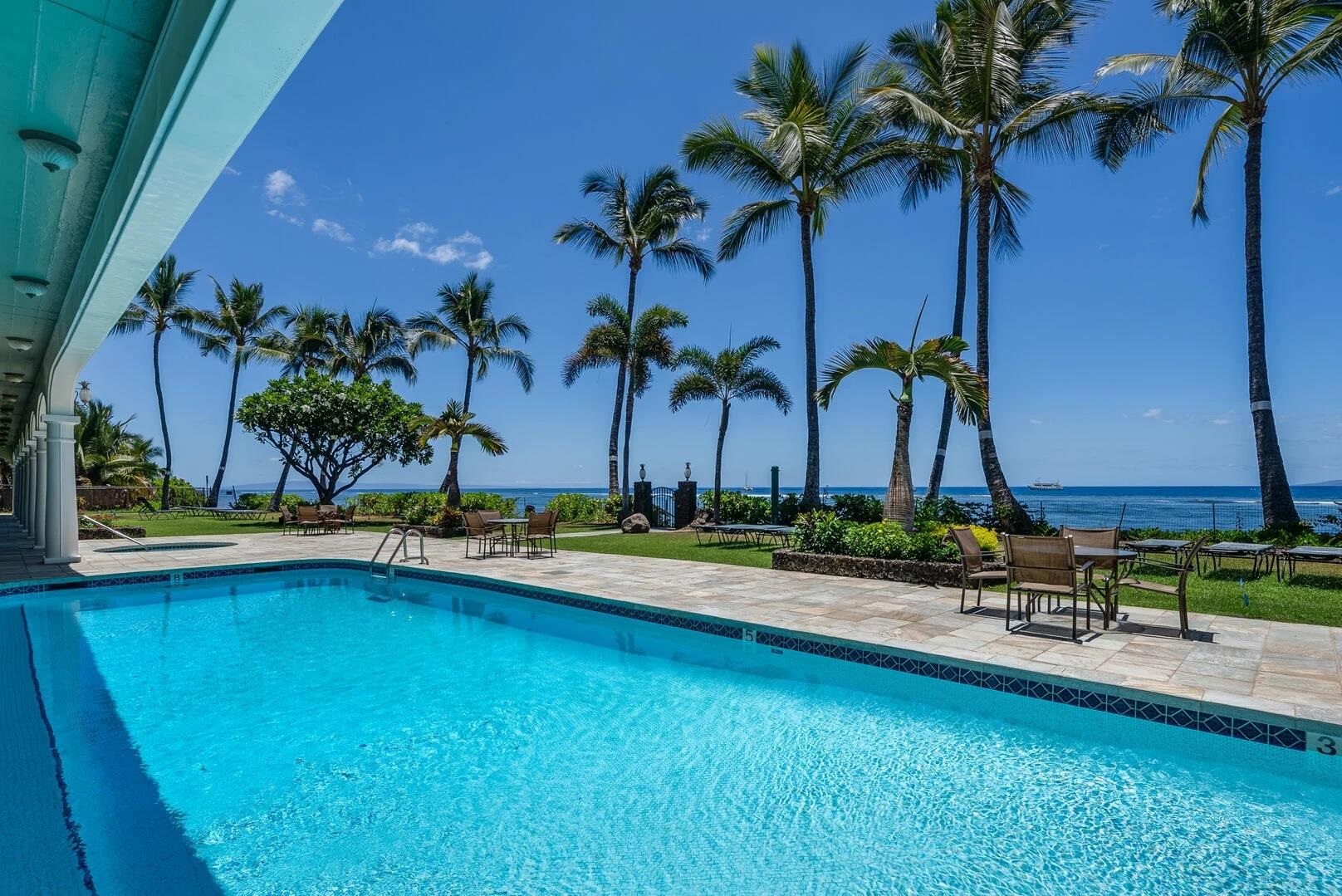 475 Front Street, Unit 419 Lahaina, HI 96761 - Photo 15 of 27 a view of a swimming pool with a table and chairs