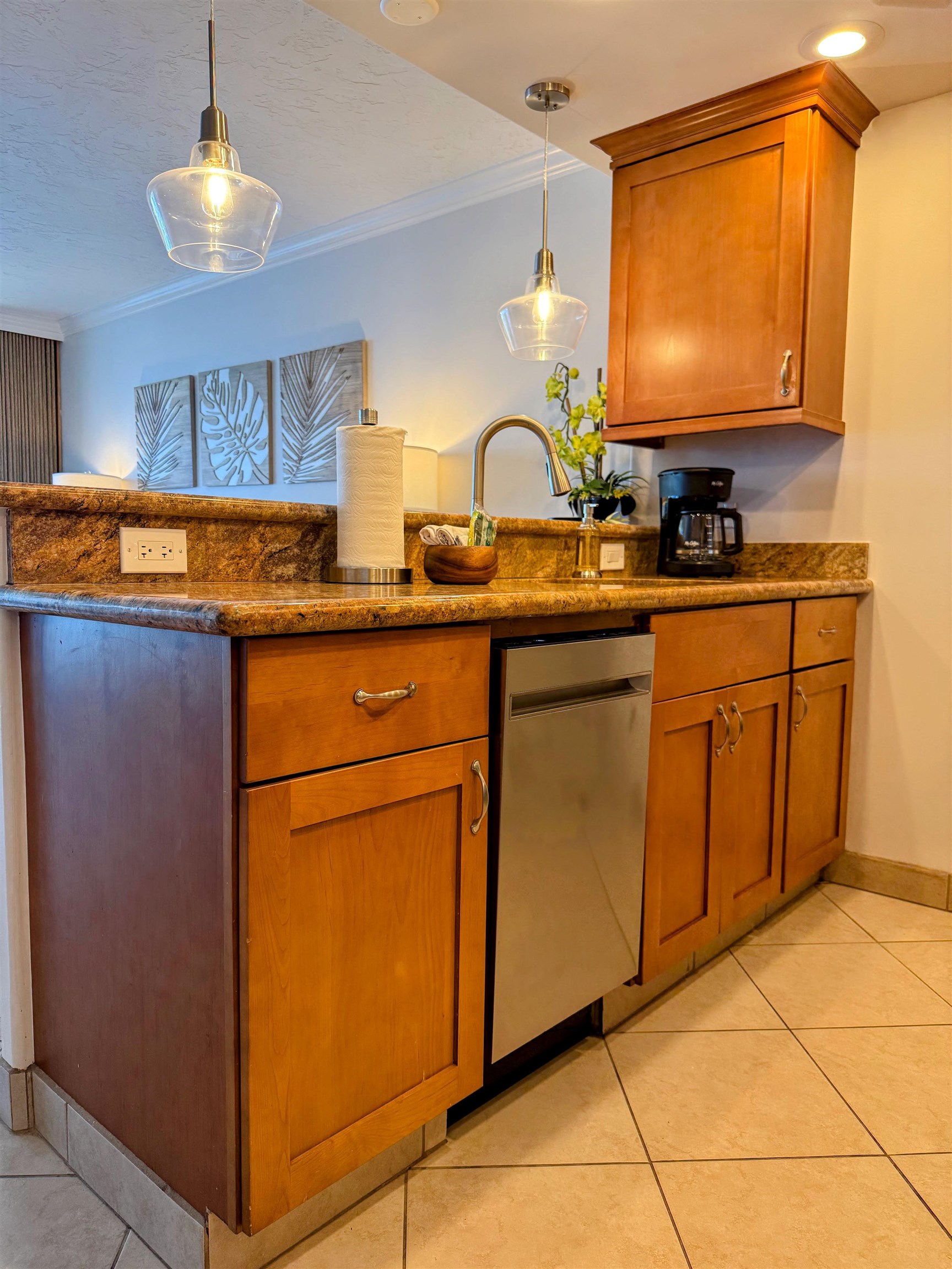 475 Front Street, Unit 419 Lahaina, HI 96761 - Photo 18 of 27 a kitchen with stainless steel appliances granite countertop a sink stove and cabinets