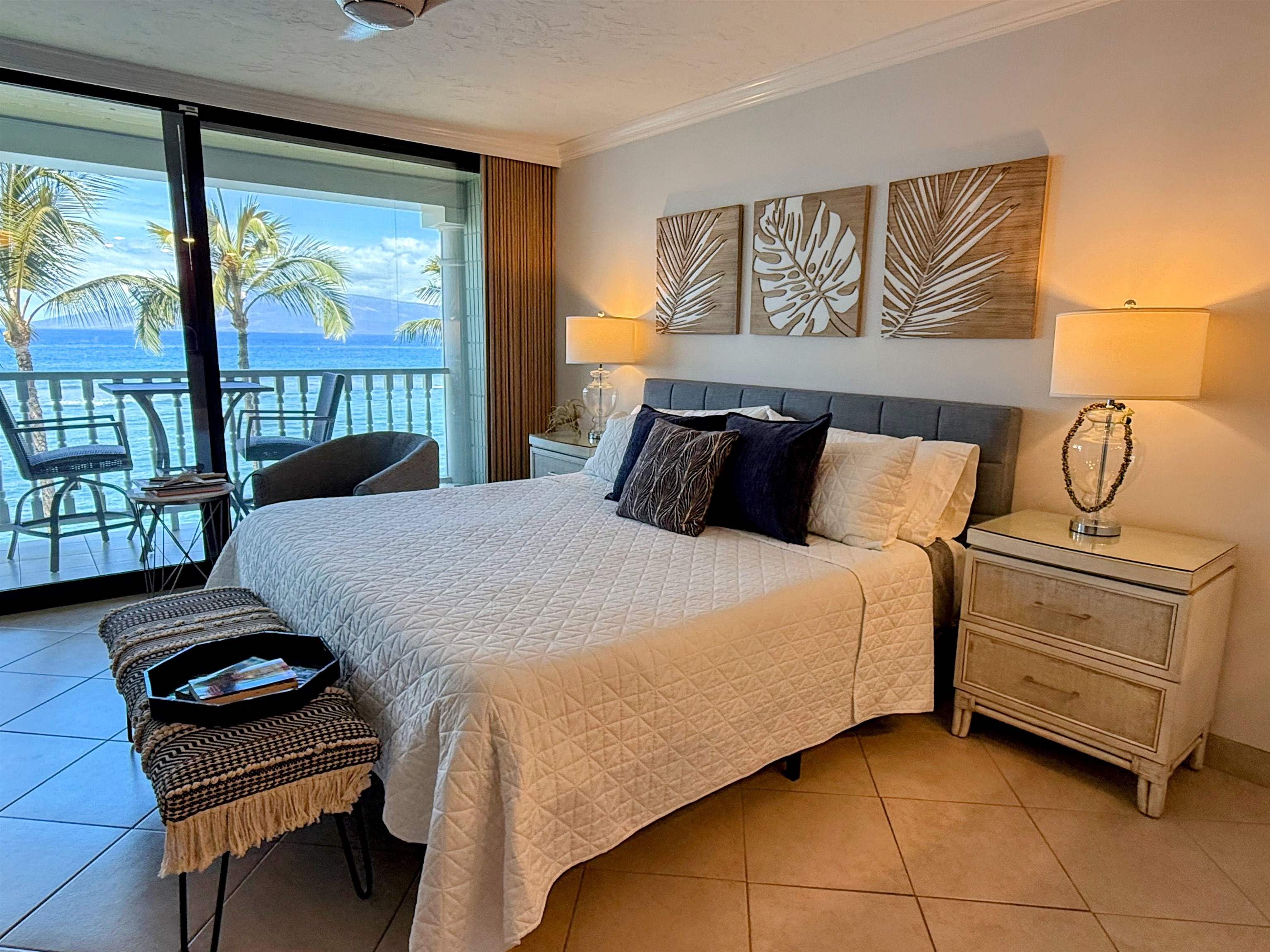 475 Front Street, Unit 419 Lahaina, HI 96761 - Photo 5 of 27 a bedroom with a bed and wooden floor