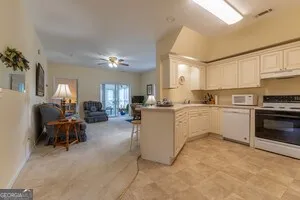 a kitchen with cabinets a sink and a stove