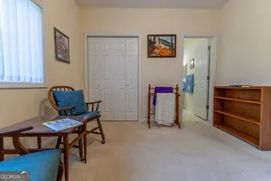 a living room with furniture and a chair