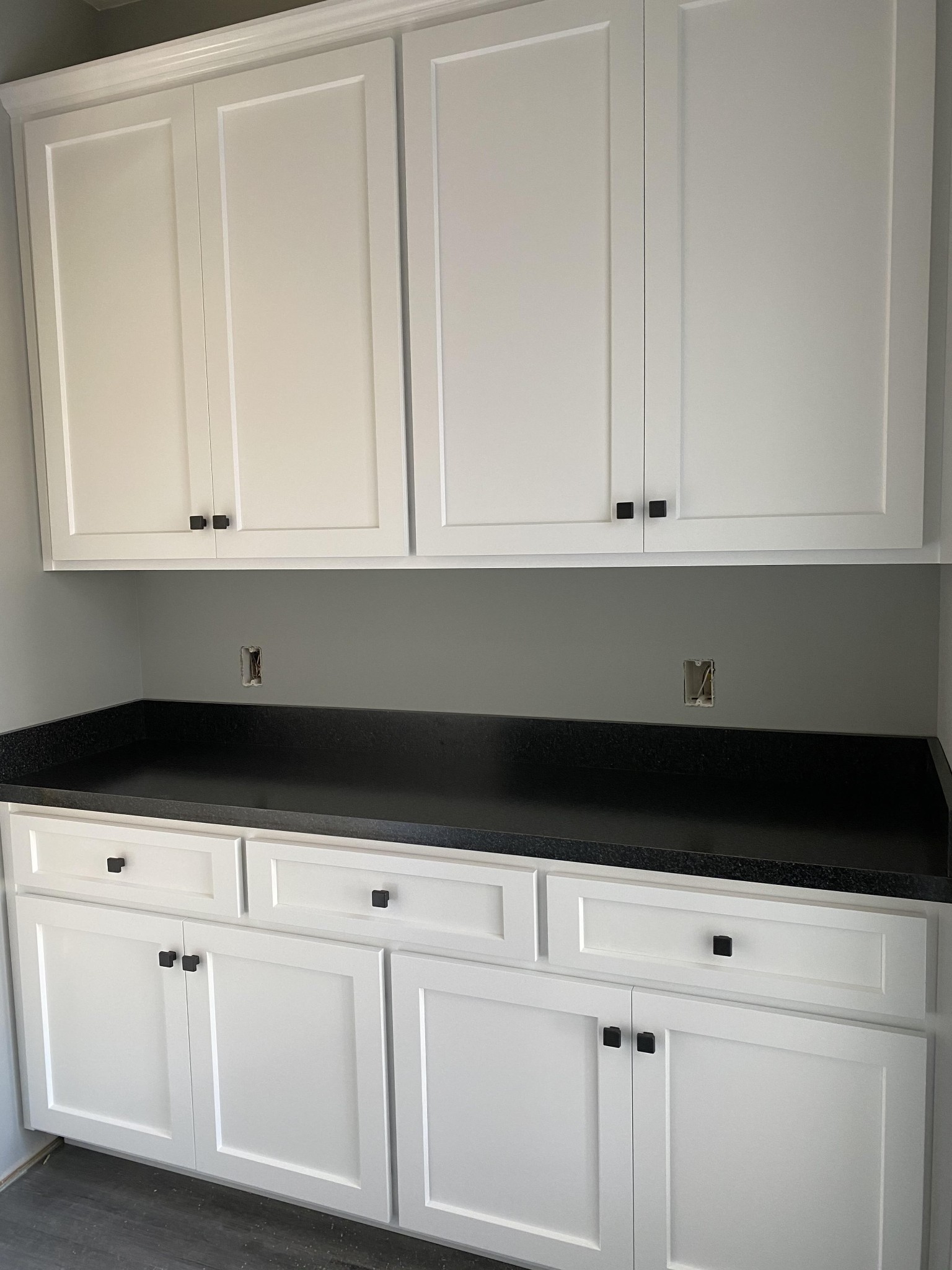 367 Duck River Road Manchester, TN 37355 - Photo 7 of 12 a kitchen with white cabinets and black appliances