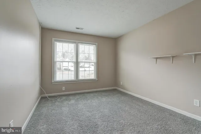 a view of a balcony with wooden floor and fence