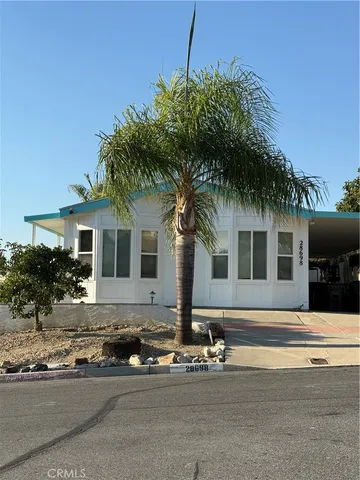 a front view of a house with yard