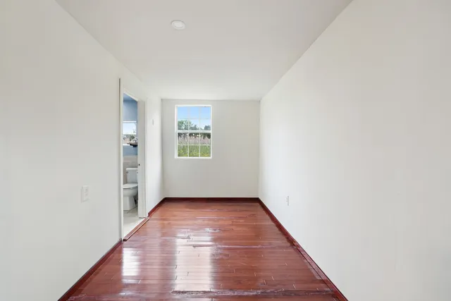 a bathroom with a double vanity sink toilet mirror and shower