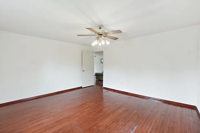 a bathroom with a granite countertop sink and a bathtub
