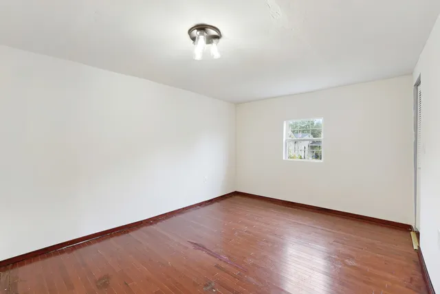 a view of a livingroom with furniture and wooden floor