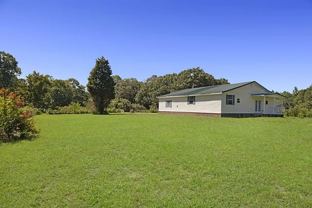 a view of a lake with a yard