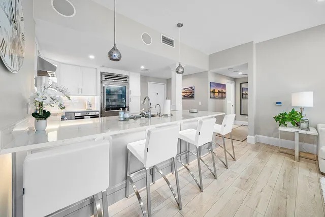 a kitchen with a dining table and chairs
