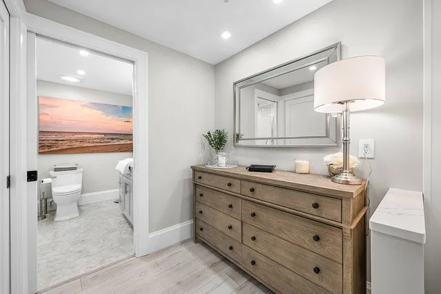 a bathroom with a toilet sink and shower