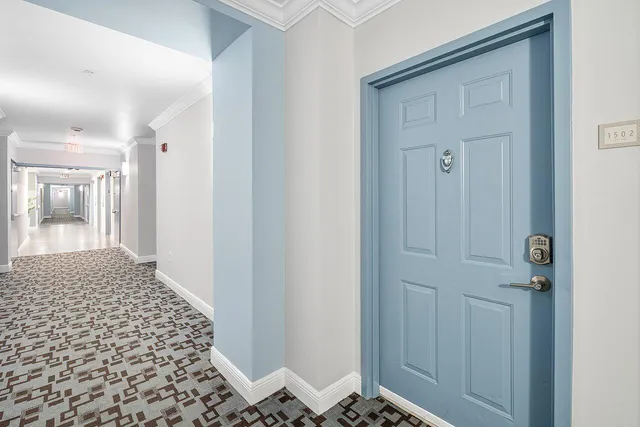 an aerial view of a house with a street