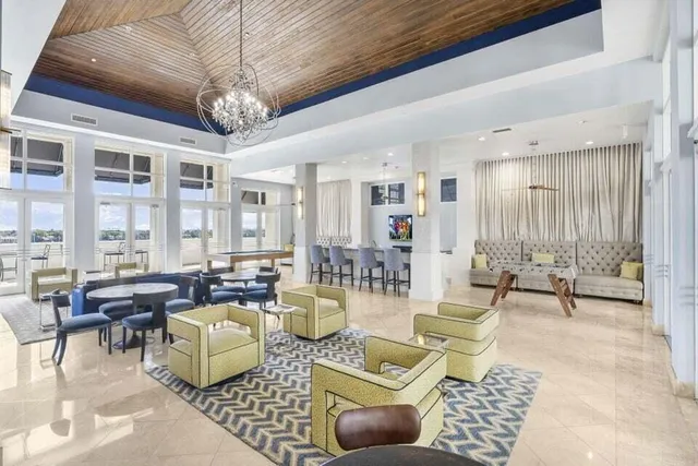 a living room with lots of furniture and a table