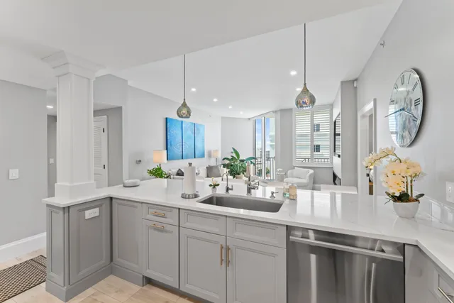 a kitchen with cabinets stainless steel appliances and a counter top space