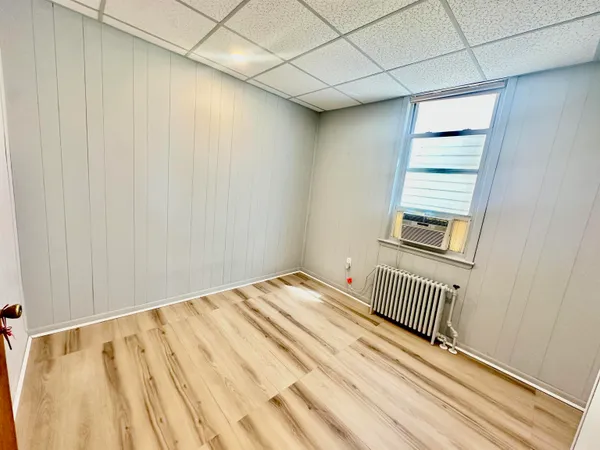 a view of a room with wooden floor and stairs