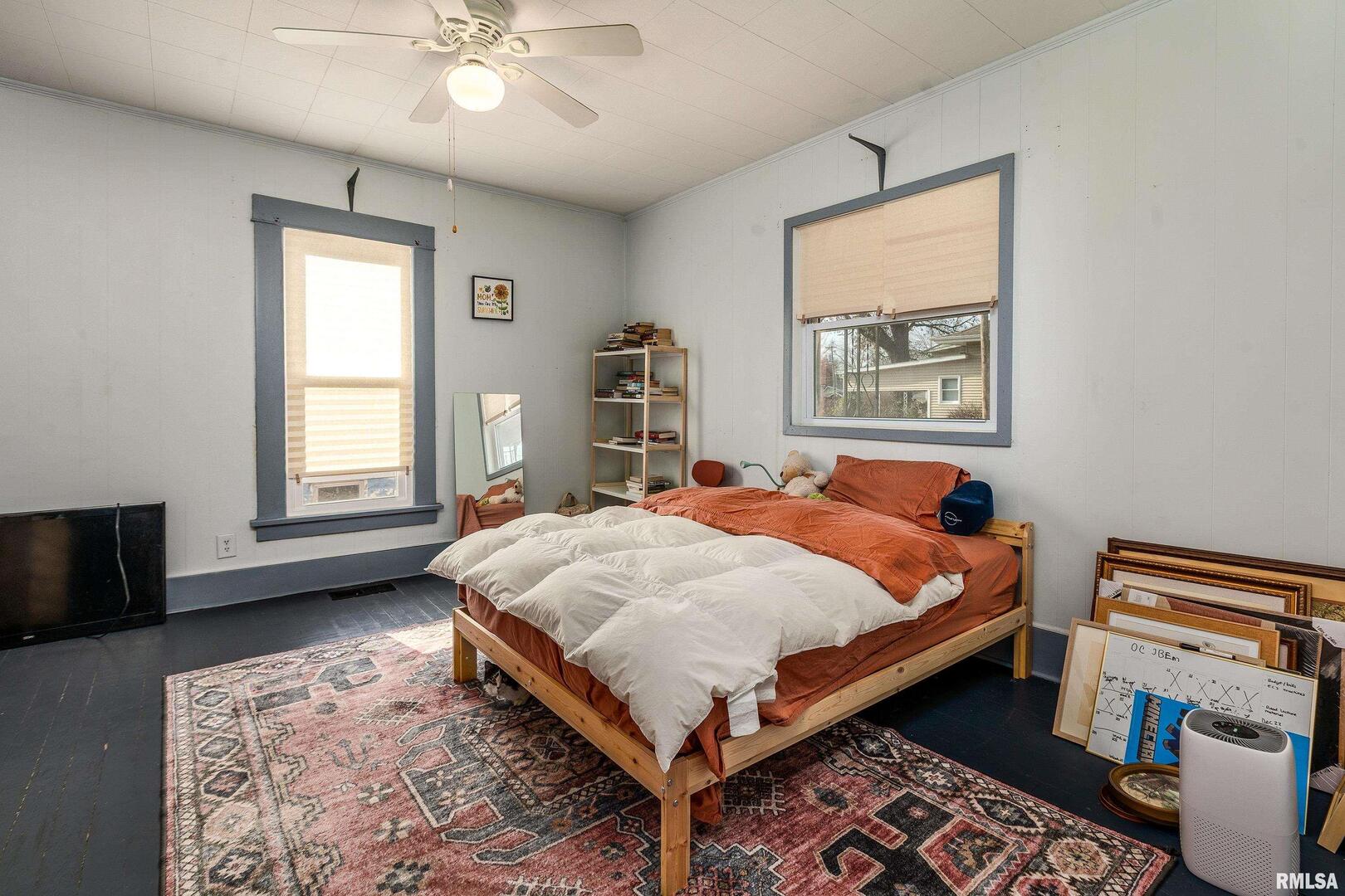 501 South Buchanan Street Marion, IL 62959 - Photo 14 of 32 a bed sitting in a bedroom next to a window