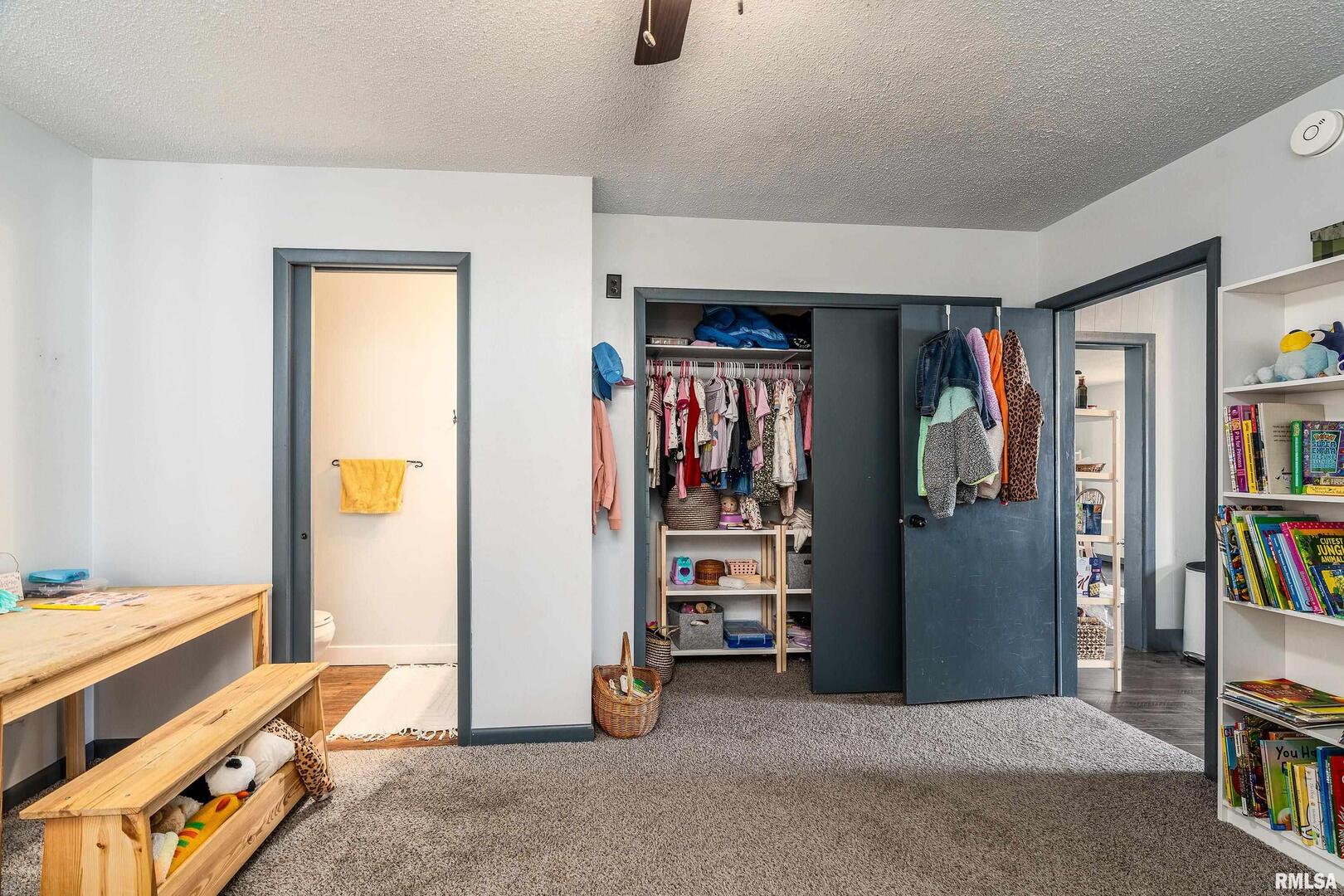 501 South Buchanan Street Marion, IL 62959 - Photo 19 of 32 a view of walk in closet with clothes and shoes