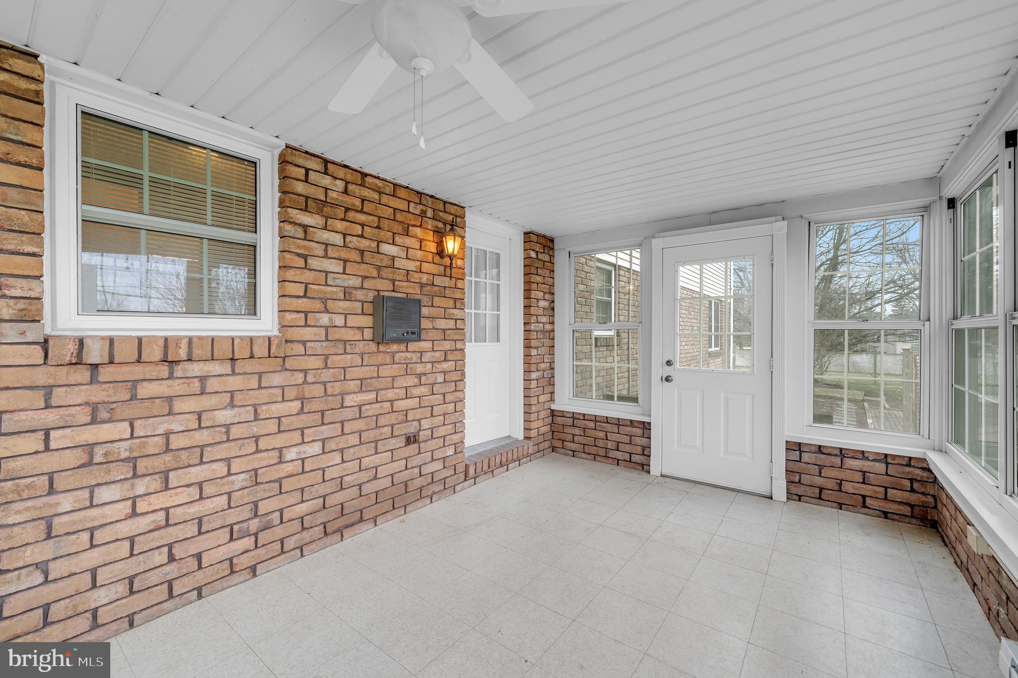 5013 East Berlin Road East Berlin, PA 17316 - Photo 19 of 44 Door to the side and back yards from the sun porch