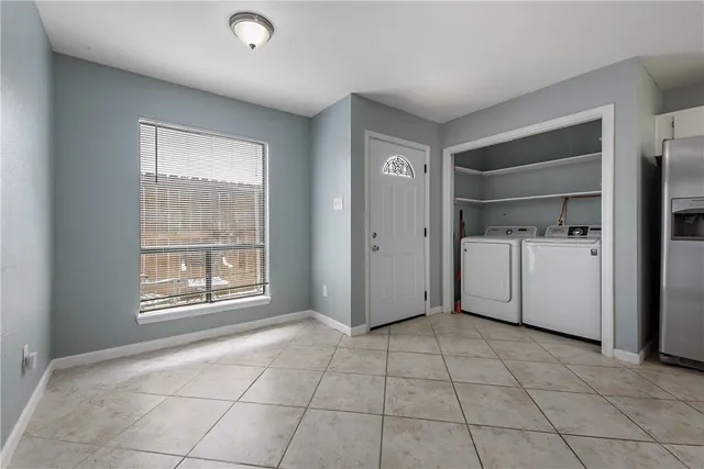 a view of a storage & utility room and a window