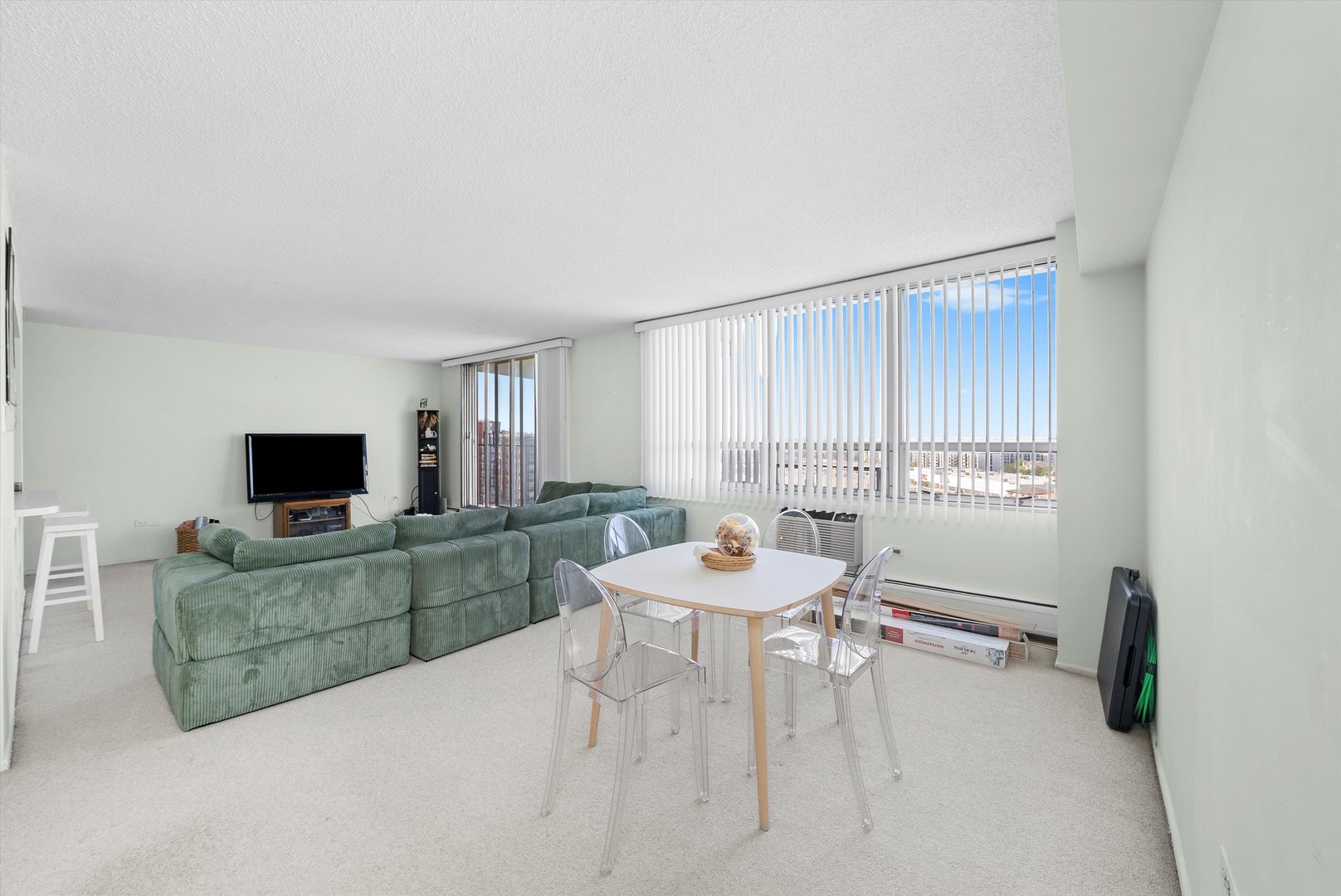 8815 West Golf Road, Unit 11C Niles, IL 60714 - Photo 11 of 31 a living room with furniture and a flat screen tv