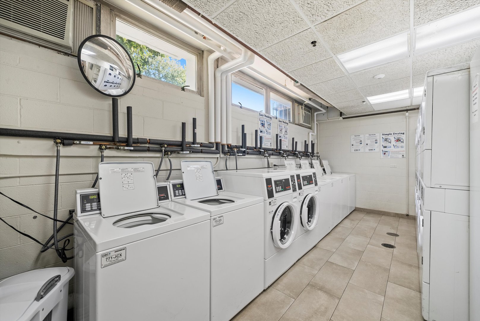 8815 West Golf Road, Unit 11C Niles, IL 60714 - Photo 25 of 31 a utility room with dryer and washer