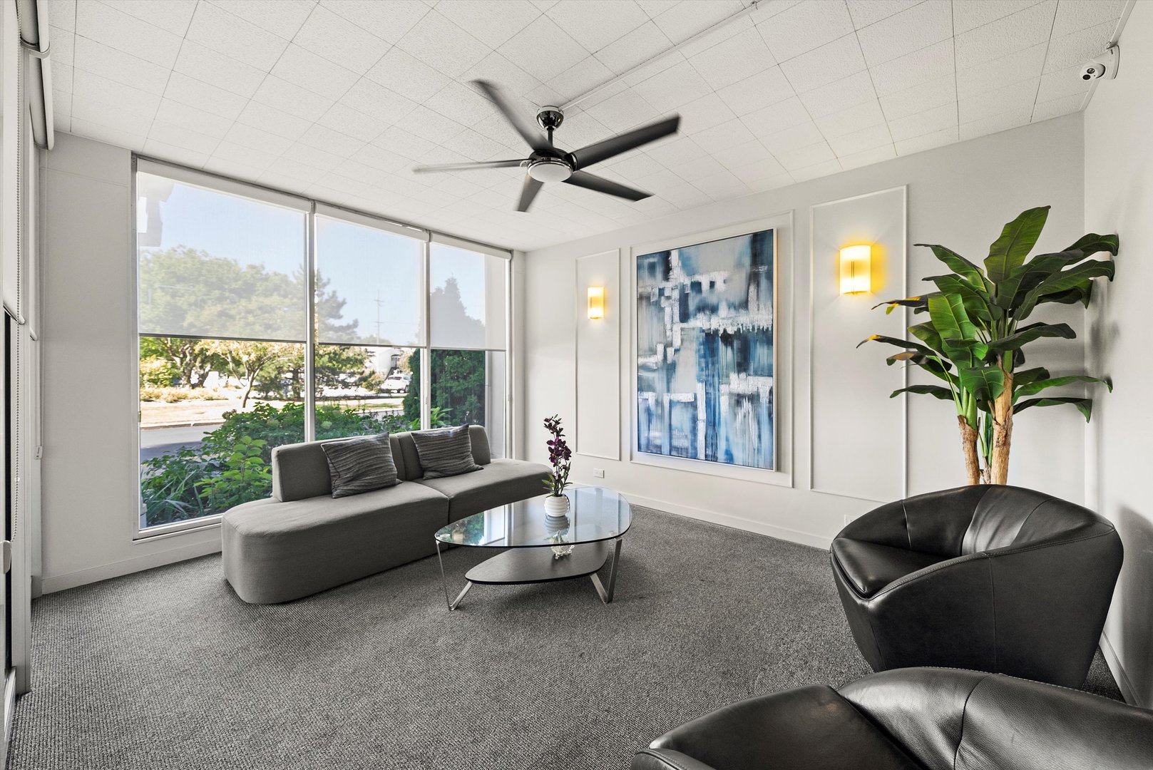 8815 West Golf Road, Unit 11C Niles, IL 60714 - Photo 27 of 31 a living room with furniture and a large window