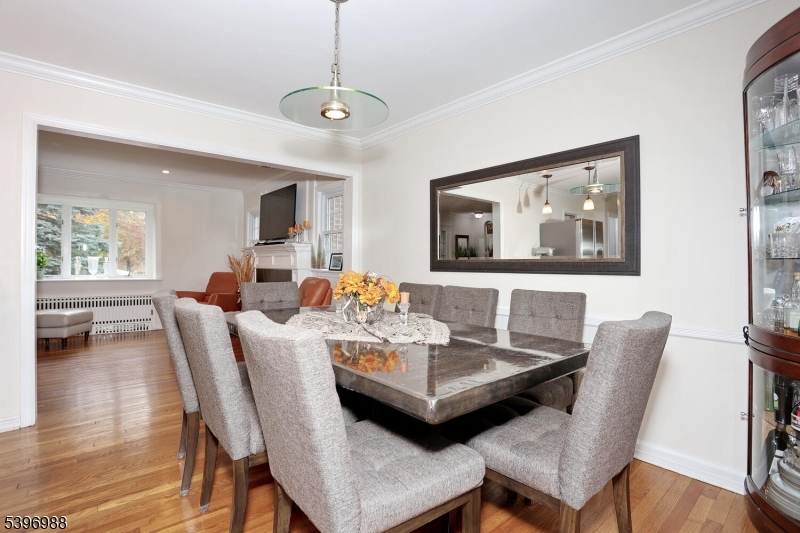12 Pershing Avenue Ridgewood, NJ 07450 - Photo 16 of 42 a view of a dining room with furniture and wooden floor