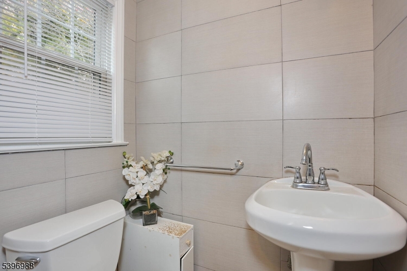 12 Pershing Avenue Ridgewood, NJ 07450 - Photo 19 of 42 a bathroom with a toilet sink and mirror