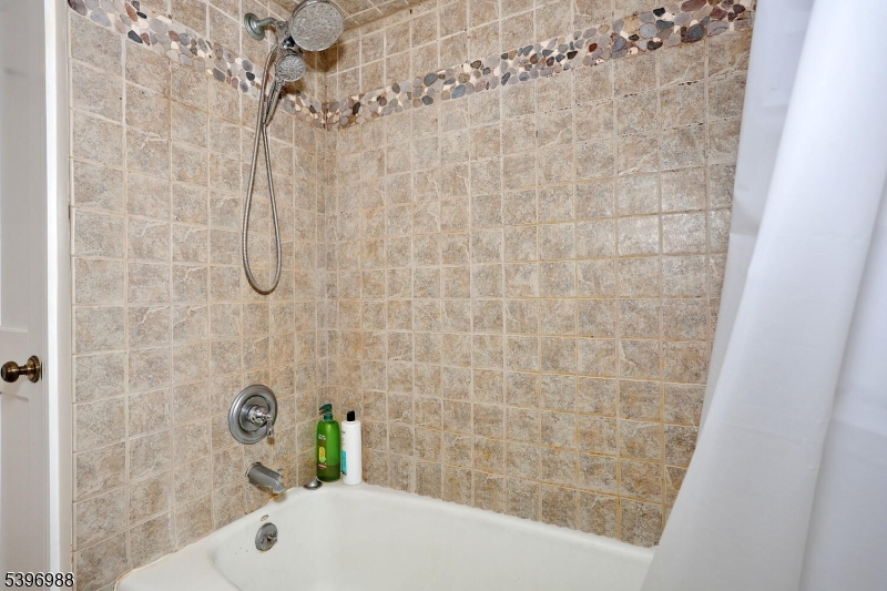 12 Pershing Avenue Ridgewood, NJ 07450 - Photo 24 of 42 a bathroom with a shower and a sink