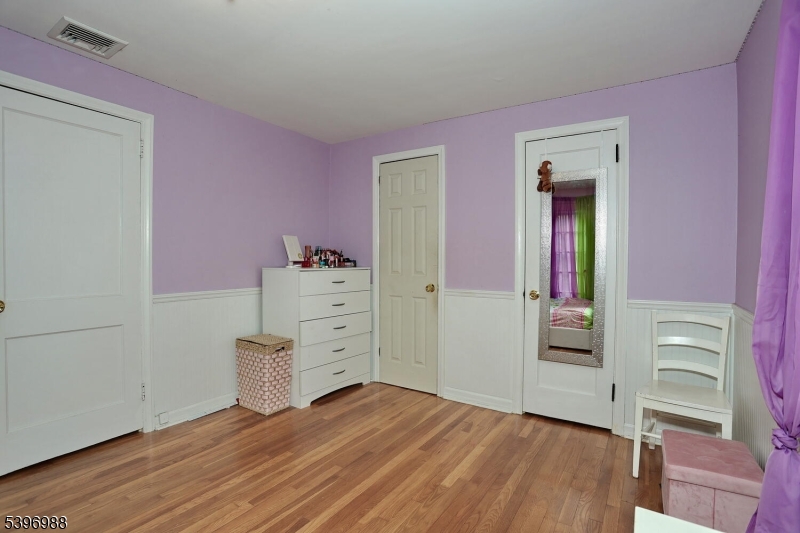 12 Pershing Avenue Ridgewood, NJ 07450 - Photo 25 of 42 wooden floor and windows in a bedroom