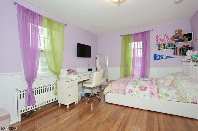 12 Pershing Avenue Ridgewood, NJ 07450 - Photo 26 of 42 a bedroom with a bed and a window