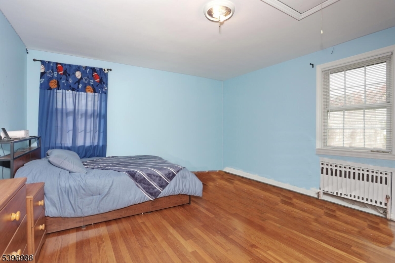 12 Pershing Avenue Ridgewood, NJ 07450 - Photo 29 of 42 a bedroom with a bed and a window