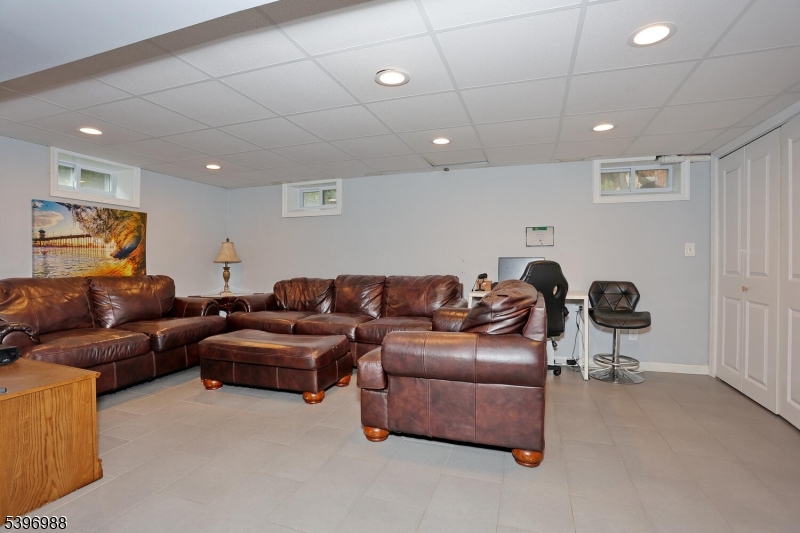 12 Pershing Avenue Ridgewood, NJ 07450 - Photo 31 of 42 a living room with a couch and a coffee table