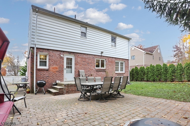 12 Pershing Avenue Ridgewood, NJ 07450 - Photo 38 of 42 a view of a house with patio and a yard