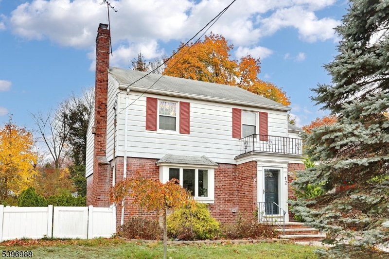 12 Pershing Avenue Ridgewood, NJ 07450 - Photo 4 of 42 a front view of a house with garden